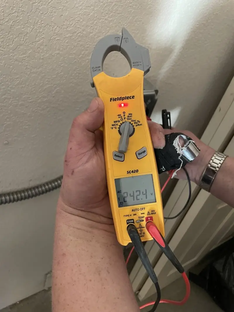 Voltage testing with clamp meter during Ceiling Fan Installation in Tell City